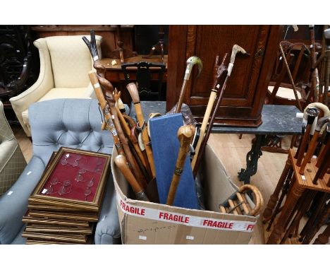 A collection of walking sticks, walking cane and shepherd's crooks, various mediums and terminal designs to include painted t