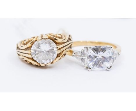 Two 9ct gold and cubic zirconia set dress rings, to include a Victorian style scrolled mount set with a round cut cz, size N,