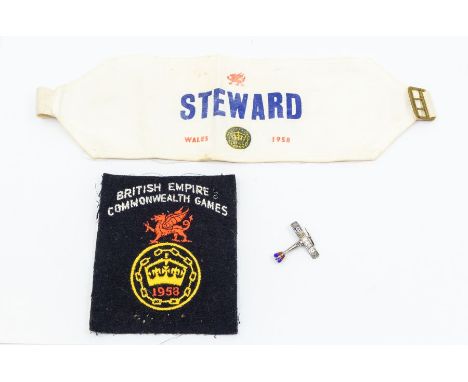 A silver and enamel spitfire RAF badge, with enamel target decoration, along with 1958 British Empire Commonwealth Games clot