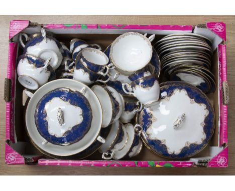 A Staffordshire tea and dinner set, including cups, saucers, milk and sugar, plates, tureens, twin handled bowls, etc