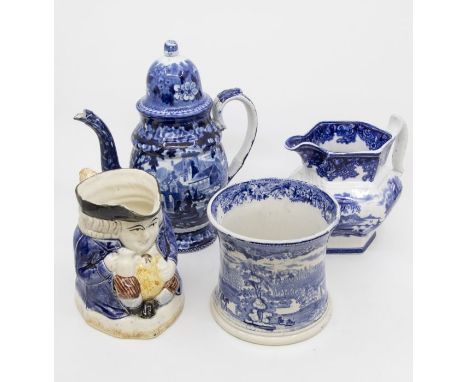 A collection of early to mid 19th Century blue and white ceramics including a teapot, water jug, large mug, along with a Toby