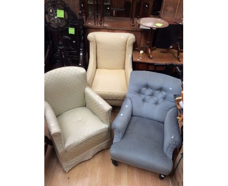 Three sofa chairs, Victorian and 20th Century, all on casters, recovered&nbsp;