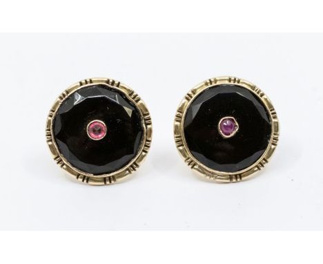 A  pair of Russian onyx and ruby 14ct gold earrings, circular form set to the centre with a ruby/paste , overlaid on onyx wit
