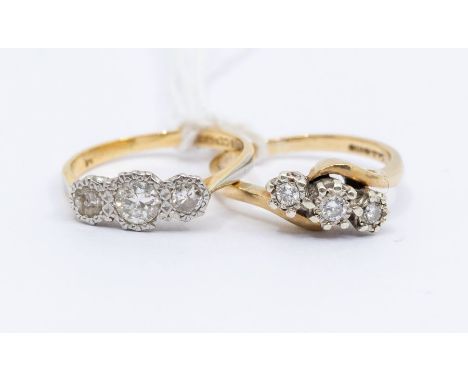 A diamond and 9ct gold three stone ring, comprising three round brilliant cut diamonds with a total diamond weight approx. 0.