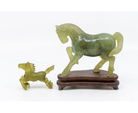 A Jadeite carved Horse on hardwood stand and another jade type small horse. (2)