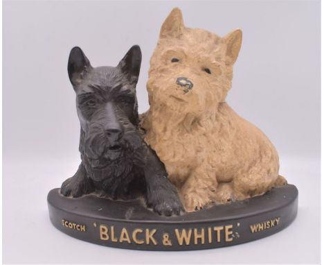 Black and white scotch whisky advertising stand.