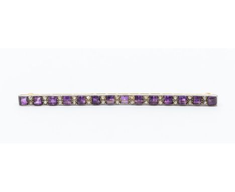 An early 20th century  amethyst and diamond set yellow metal bar brooch, comprising alternate square cut amethysts and double