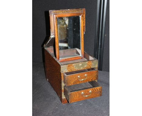 Chinese cabinet, with a hinged lid opening to reveal a flip mirror above two drawers, 21cm wide