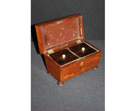 19th Century mahogany tea caddy, the hinged lid opening to reveal two interior compartments, raised on four squat bun feet, 2