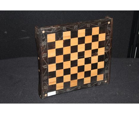 West African ebonised chess board, on bracket feet, 32cm x 30.5cm