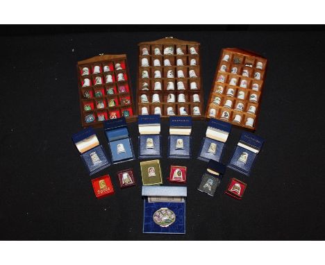 Halcyon Days enamel patch box, 1999, together with a collection of thimbles, Royal Worcester examples and others, (qty)