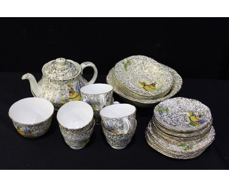 Royal Crown Pottery Trentham pattern bone china tea service and matching similar fruit set, decorated with a lady in a garden