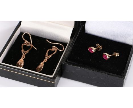 Two pairs of 9 carat gold rings, the first of drop from, the second with red stones 