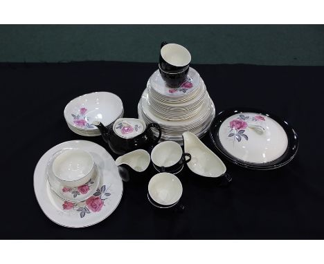 Johnson Brothers dinner and tea service, the black and white ground with rose decoration, consisting of five dinner plates, s