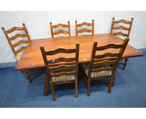 A THEODORE ALEXANDER STYLE FRUITWOOD REFRECTORY TABLE, on an ornate base united by metal stretchers, length 183cm x depth 107