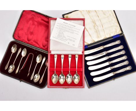 TWO CASED SETS OF SILVER TEASPOONS AND A CASED SET OF SILVER HANDLED BUTTER KNIVES, the first set of six teaspoons each with 