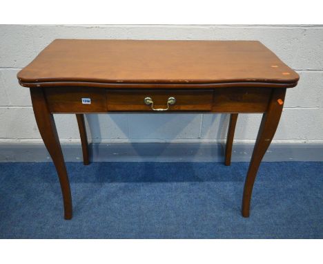 A STAKMORE HARDWOOD CONSOLE/EXTENDING DINING TABLE, with two additional leaves, extended dining table length 183cm x closed l