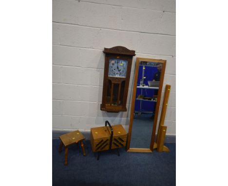 AN EARLY 20TH CENTURY OAK WALL CLOCK, along with a cantilever sewing box, a milking stool and a pine cheval mirror (no bolts)