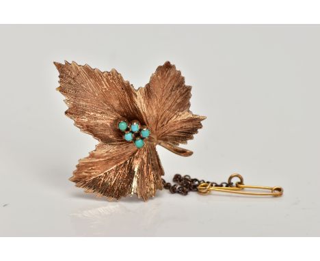 A 9CT GOLD BROOCH, in the form of a textured leaf, to the centre are five small turquoise cabochons, hallmarked 9ct gold Lond