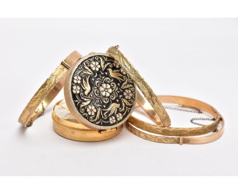 FOUR ROLLED GOLD HINGED BANGLES, each with an engraved foliate or scroll design, each with slide locking clasps, also fitted 