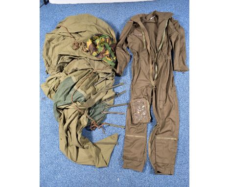 A BOX CONTAINING A MILITARY BIVOUAC TENT with metal pegs, a Military Aviators suit, camo item (hood)