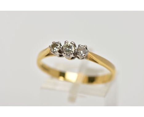 AN 18CT GOLD THREE STONE DIAMOND RING, designed with a row of three graduated round brilliant cut diamonds, total estimated d