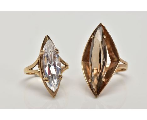 TWO 9CT GOLD DRESS RINGS, the first designed with a marquise shape smokey quartz within a four claw setting and angular outer