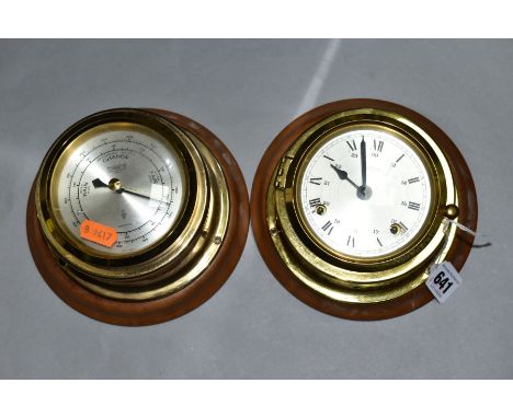 A WEMPE BRASS CASED SHIPS STYLE BAROMETER AND MATCHING WALL CLOCK, both with loose wooden wall fixings , barometer with compe