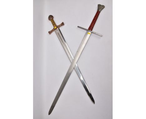 TWO REPLICA COPY SWORDS, a Medieval style sword, with approximately 83cm length blade, slightly fullered, large or-nate cross