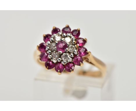 A 9CT GOLD RUBY AND DIAMOND CLUSTER RING, designed as a tiered cluster of circular cut rubies and brilliant cut diamonds with