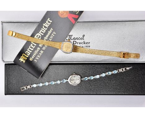 TWO BOXED LADIES WRISTWATCHES, the first a white metal watch with an oval mother of pearl dial signed 'Precious Time, Quartz'