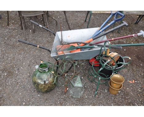 A MODERN WHEELBARROW, a quantity of garden tools, buckets and planters etc
