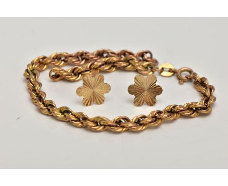 A 9CT GOLD AF ROPE TWIST BRACELET AND A PAIR OF YELLOW METAL STUD EARRINGS, the broken hollow rope twist bracelet, fitted wit