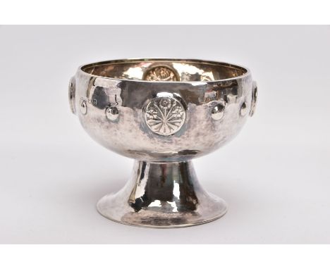 AN ARTS &amp; CRAFTS SILVER ROSE BOWL, hammer effect to the bowl, embossed floral and foliate emblems and beaded design, tape