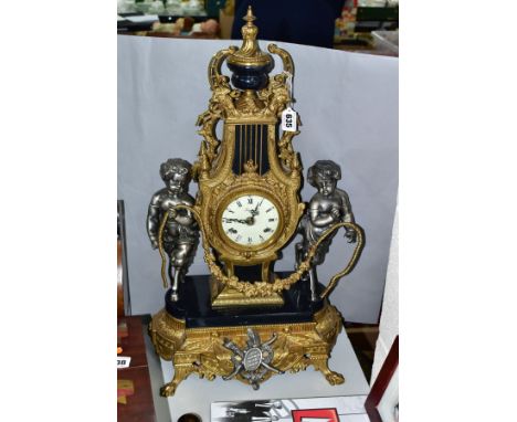 A 20TH CENTURY ITALIAN 'IMPERIAL' 18TH CENTURY STYLE MANTEL CLOCK, the brass and black metal lyre shaped case flanked by a pa