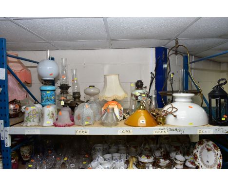 A QUANTITY OF VINTAGE GLASS AND METAL LAMPS, SHADES AND FITTINGS, to include oil and electric lamps, chimneys, lampshades and