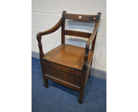 A GEORGIAN OAK COMMODE CHAIR, with open armrests and ceramic bowl