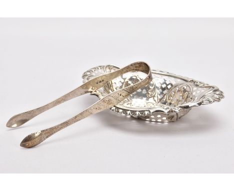 A SILVER BONBON DISH AND A PAIR OF SUGAR TONGS, the bonbon dish of an oval form, pierced bowl with floral and scroll embossed