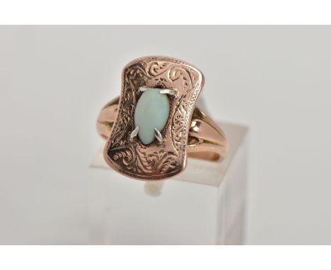 AN EARLY 20TH CENTURY 9CT GOLD OPAL RING, the head of the ring of a rounded rectangular shape with an engraved foliate design