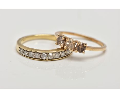 TWO 9CT GOLD DIAMOND SET RINGS, the first a three stone brilliant cut diamond ring with champagne coloured diamonds, estimate