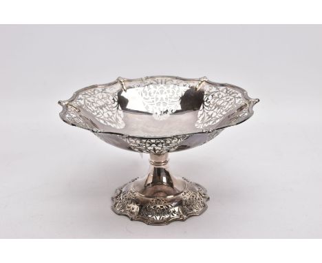 A PIERCED SILVER COMPORT, pierced floral decorative design, wavy rim, on a pierced wavy rim base, approximate height 12cm, wi