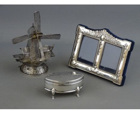 A DUTCH SILVER TABLE NOVELTY in the form of a windmill,12.5 cms high, a modern silver fronted double photograph frame with ea