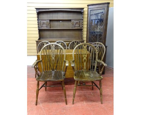 A MIXED SUITE OF DINING ROOM FURNITURE to include a Priory style oak dresser and glazed top corner cabinet with a vintage oak