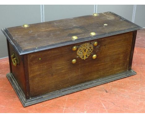 AN ANTIQUE MAHOGANY LIDDED BLANKET CHEST, the edge moulded top with large brass button decoration and iron strap hinges with 