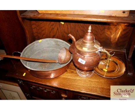 An Eastern copper and brass coffee pot; a copper preserve pan; ladle and a cake stand 