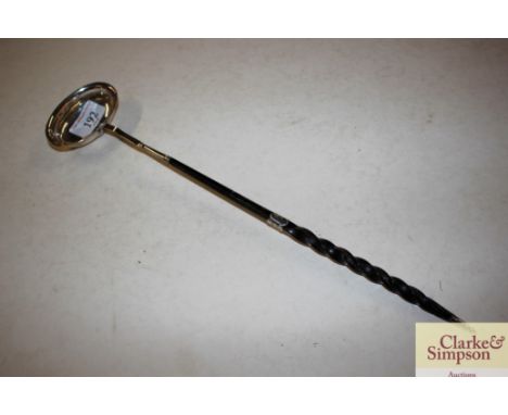 A Georgian unmarked white metal toddy ladle with whale bone twist handle 