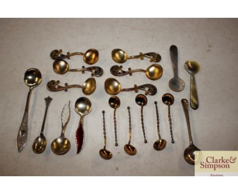 A small collection of silver enamel and other miniature spoons, some with filigree decoration
