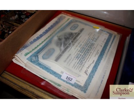 A quantity of old share certificates etc.