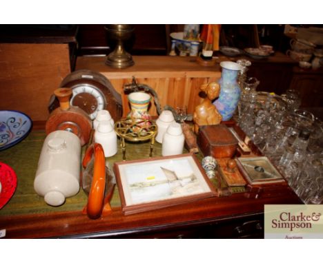 An oak striking mantel clock; a stone glazed hot water bottle; a gilt metal twin branch wall light; a decorative teapot; wood