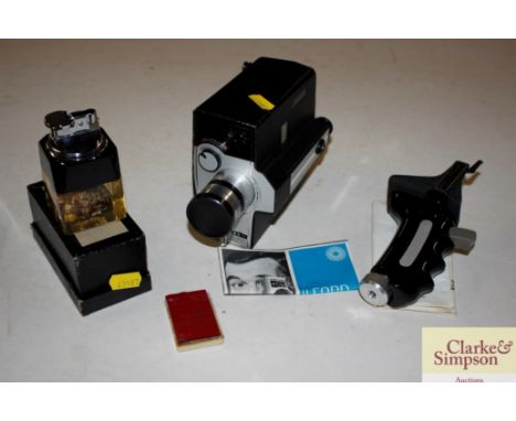 A Bell &amp; Howell Reflex zoom cine camera and a collector's Ronson table lighter 